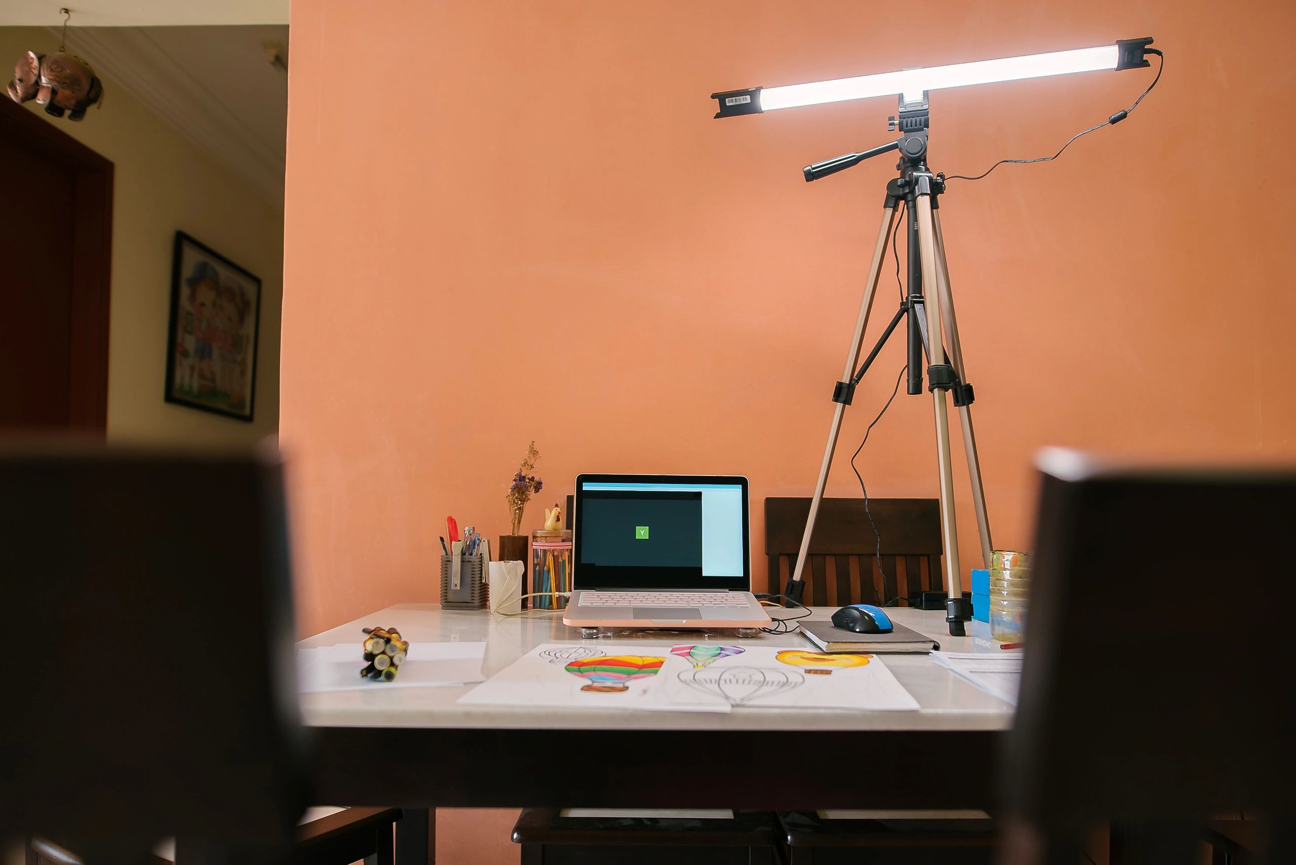 Home desk setup with laptop ready for a video call.