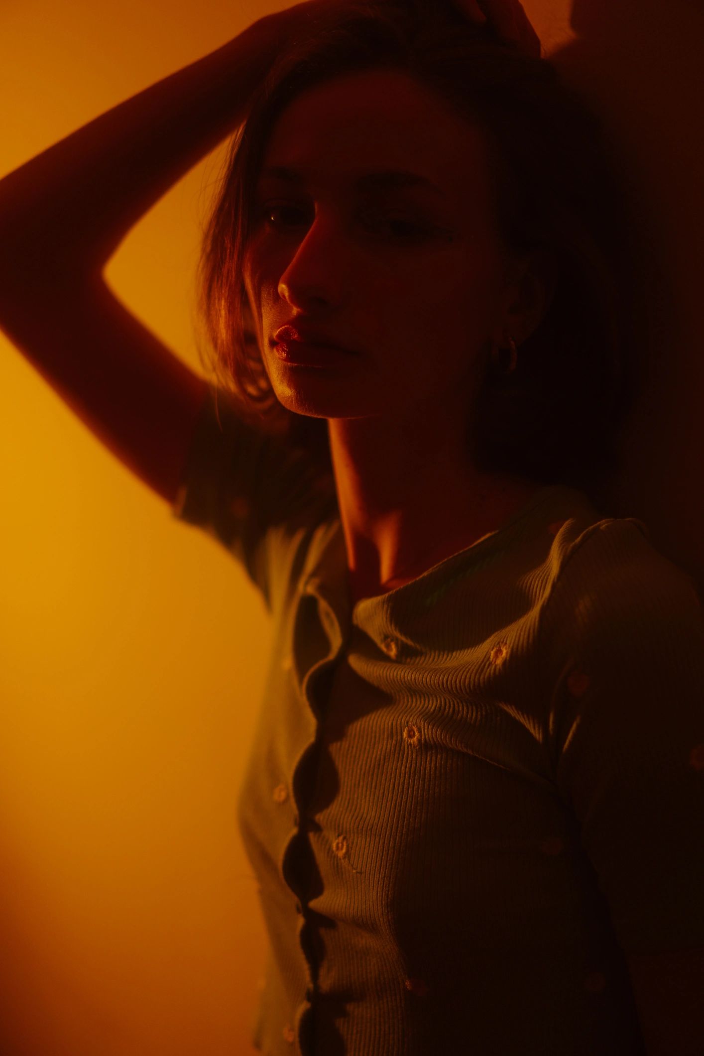 Portrait of a woman in a studio setting with soft, modern lighting.