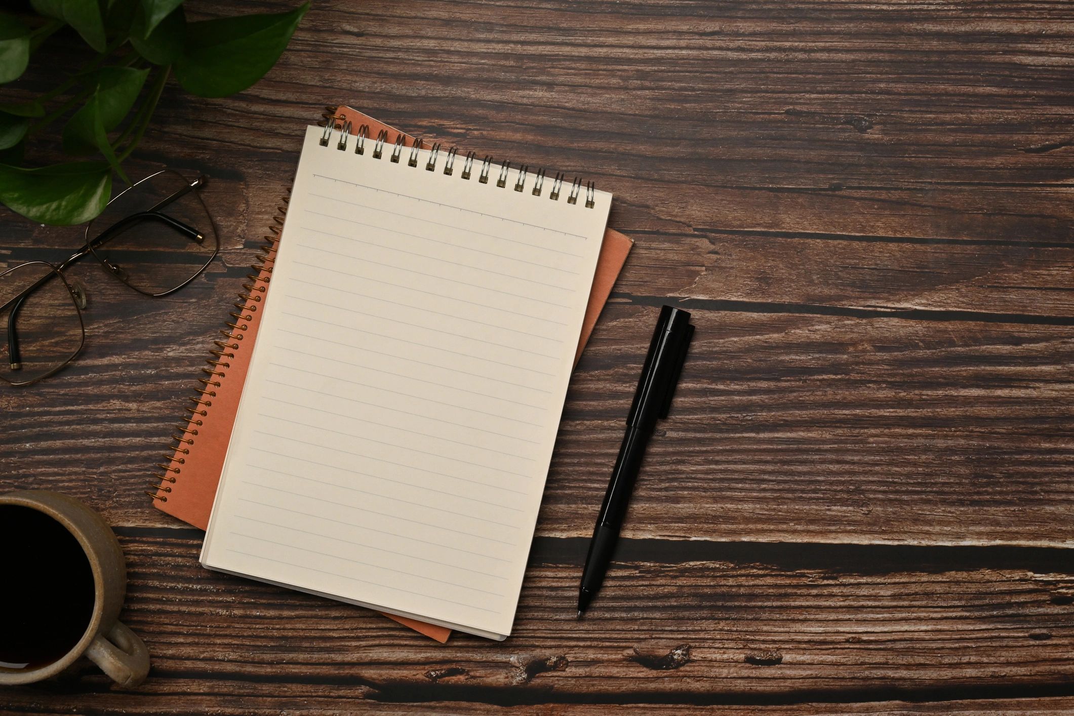 Notebook and pen for journaling prompts